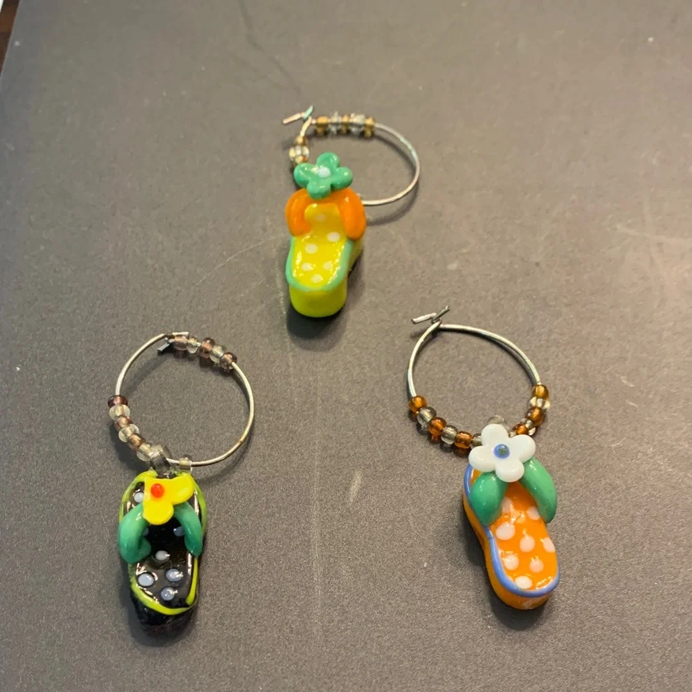 Pier 1 drink charms in the shape of flip flops. Only 3 charms available.
